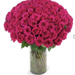 Large bouquet of hot pink roses in a clear glass vase