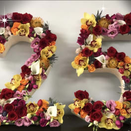 Floral number 25 covered in roses and orchids