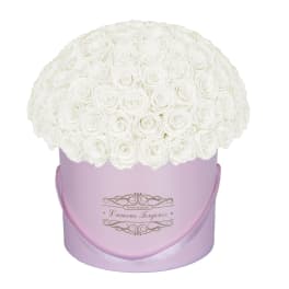Round bouquet of white roses in a lavender hatbox