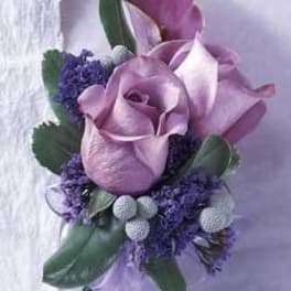 Purple calla lily bouquet with lavender ribbon and small purple accents