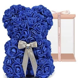 Blue rose teddy bear with a ribbon bow in a gift box