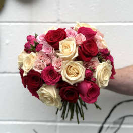 Bouquet of red, pink, and cream roses