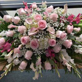 Large pink and white floral spray with roses and calla lilies