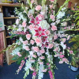 Large pink and white floral standing spray with lilies and roses