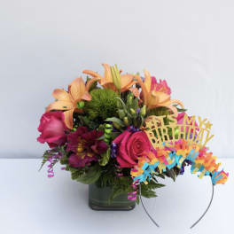 Birthday bouquet with pink roses, orange lilies, and a headband