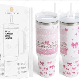 White handled tumbler with pink bow and mama text design beside branded box and straws