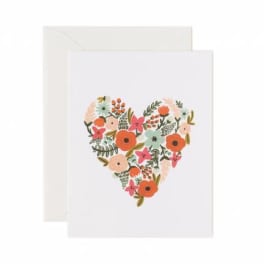 Greeting card with a floral heart design on the front