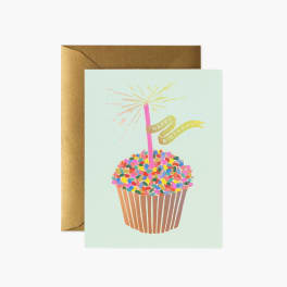 Birthday card with a cupcake and sparkler, shown with a gold envelope