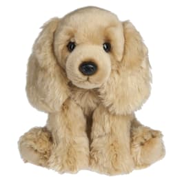 Plush tan puppy with floppy ears sitting on a white background