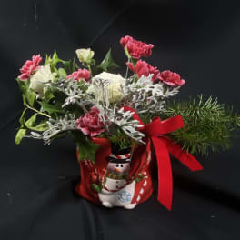 Christmas bouquet in a snowman container with red ribbon