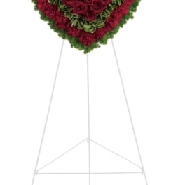 Heart-shaped floral standing spray with red roses and carnations