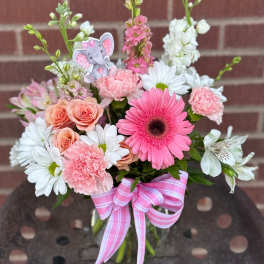 Pink and white mixed bouquet with a pink ribbon and elephant pick