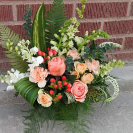 Mixed bouquet with peach roses, white blooms, and greenery