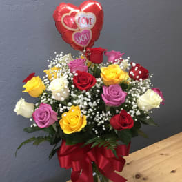 Bouquet of multicolored roses with a heart-shaped "I love you" balloon