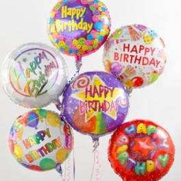 Five colorful birthday balloons with printed messages