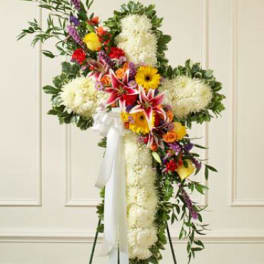 Cross-shaped floral standing spray with white blooms and colorful mixed flowers