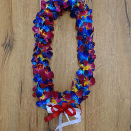 Colorful flower lei with red, blue, and yellow blossoms and a ribbon bow