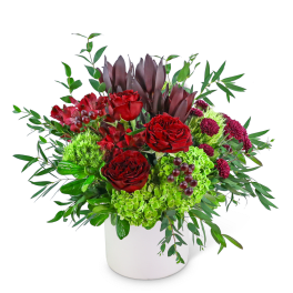 Red roses and green hydrangeas in a white vase