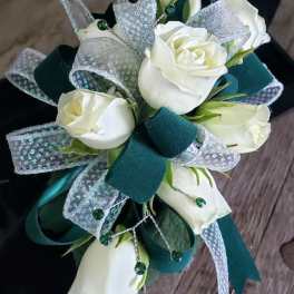 Bouquet of white roses with teal ribbon and glittery accents