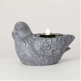 Gray bird-shaped candle holder with a lit tealight