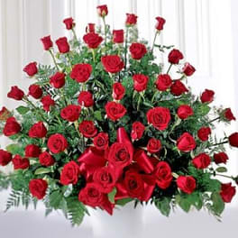 Large bouquet of red roses with a red ribbon bow