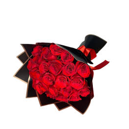 Bouquet of red roses wrapped in black paper with a red ribbon