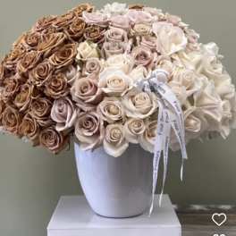 Large bouquet of roses in a white vase