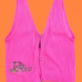 Bright pink pleated vest on an orange background