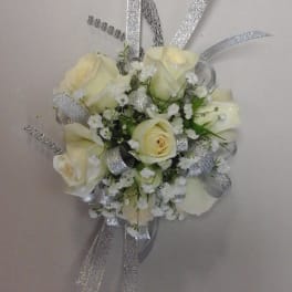 Small bouquet of cream roses with silver ribbon accents