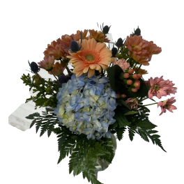 Bouquet with blue hydrangea, peach gerbera daisies, and pink flowers