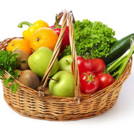 Wicker basket filled with assorted fruit and vegetables