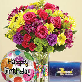 Mixed bouquet in a glass vase with a birthday balloon and gift box