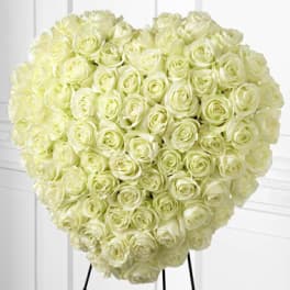 Large heart-shaped bouquet of pale cream roses
