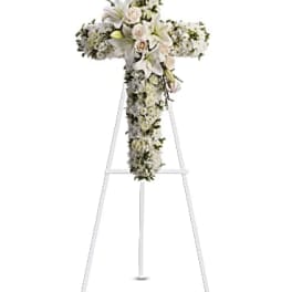 White floral cross on a standing easel