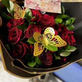 Bouquet of deep red roses with gold butterfly picks