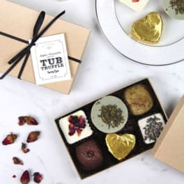 Gift boxes of assorted chocolates with dried flower petals