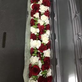 Long box of red and white carnations