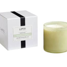 Boxed candle with a pale green glass jar