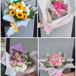 Four pastel bouquets with roses, sunflowers, and mixed blooms wrapped in paper