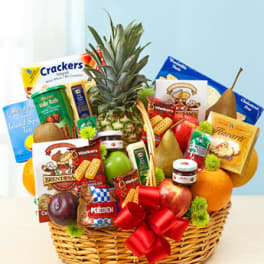 Gift basket with fruit, snacks, and a pineapple centerpiece