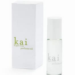 White perfume bottle beside matching box with "kai" branding