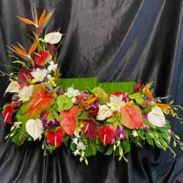 Tropical floral arrangement with anthuriums and bird of paradise