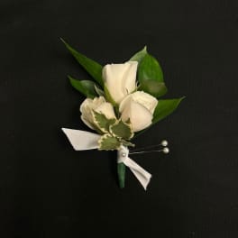 White rose boutonniere with ribbon and pearl pins