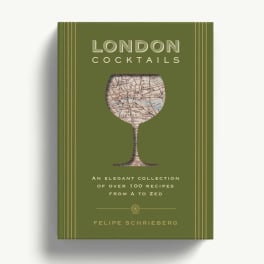 Green cocktail recipe book with a map-patterned glass on the cover