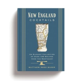 Blue cocktail recipe book with a map-shaped glass on the cover