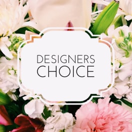 Mixed pink and white flowers with a "Designers Choice" sign