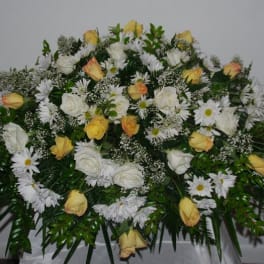 Large white and yellow floral spray with daisies and roses