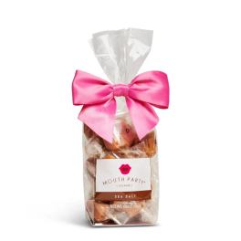 Bag of sea salt caramels tied with a pink bow