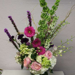 Tall mixed bouquet in a glass vase with pink and white flowers