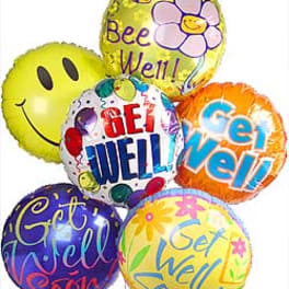 Cluster of colorful get-well balloons with cheerful messages
